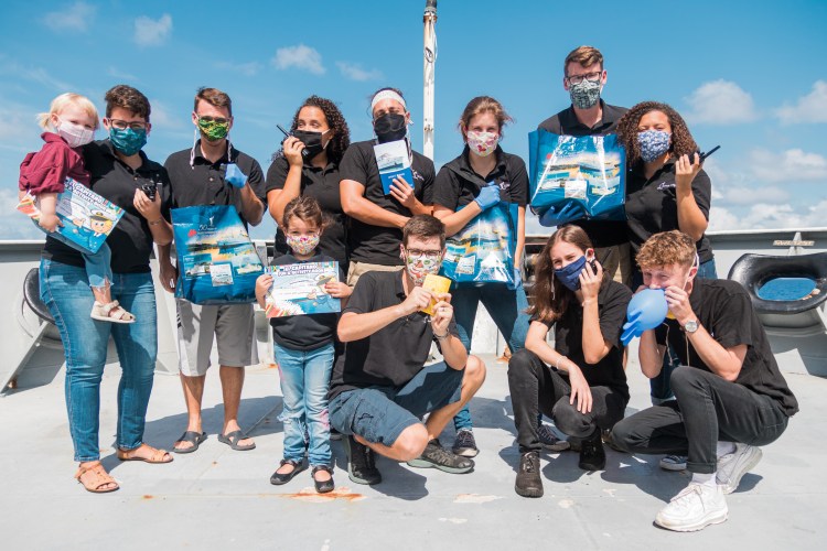 13 members of the Logos Hope Bookfair team